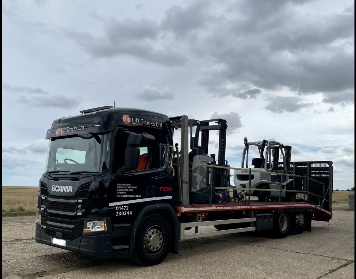 BJB lorry delivering a hired machine.